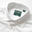 A close-up of the button up collar with mother of pearl buttons.