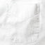 The front pocket of the white pinpoint oxford dress shirt.