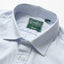 A close-up of the button up collar with mother of pearl buttons.