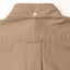 The back of the tan overdyed oxford button down shirt with a locker loop and a white buttoned collar.
