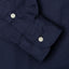 Navy button-down oxford shirt, right sleeve, white buttons, stitched cuff, buttoned cuff, made in the USA, 100% cotton.