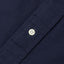 Navy button-down oxford shirt, 100% Cotton, made in the USA, white button, stitched lined placket.