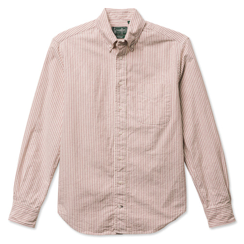 A red striped button down shirt with a chest pocket, made from a brushed oxford fabric with white buttons.