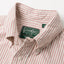 A close up photo of the red striped button down collar, white buttons green Gitman Vintage tag.