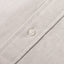 A grey brushed oxford fabric placket, with a white button.