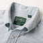 A close up photo of the blue button down collar, white buttons green Gitman Vintage tag.