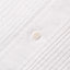 The white shirt placket with a white button and ruffles on each side of the placket.