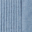 A close up of the blue chambray tuxedo shirt fabric with the ruffles.