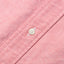 A white button on a stitched and lined placket.
