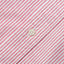 A white button on a stitched and lined placket.