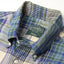 A close-up of the button down collar on the Tan/Blue Archive Madras.
