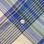 The stitched placket with a white chalk button.