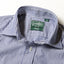 A close-up of the medium spread collar and the mother of pearl button on the lined placket.