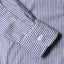 The cuff on the sleeve with two mother of pearl buttons. 