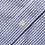 A closeup of the mother of pearl button on the lined placket.