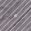 A white button on the lined placket.