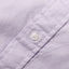 A white button on the lined placket.