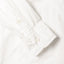The sleeve on the American Poplin with two white buttons.