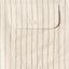 The button through flap pocket.