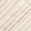 A white button on the stitched placket.