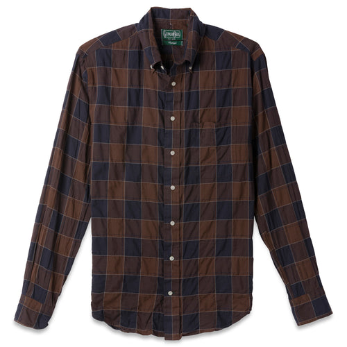The Brown Checked Organic Cotton  button down shirt, with a front pocket and white buttons on a stitched placket.
