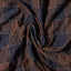The texture of the fabric on the Brown Checked Organic Cotton shirt.