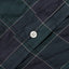 A white button on the stitched placket of the Navy Checked Organic Cotton shirt. 