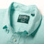 A close-up of the collar on the Teal Chambray Dobby Stripe shirt.