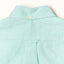 The back of the Teal Chambray Dobby Stripe shirt withe a locker loop and a a back button on the collar.