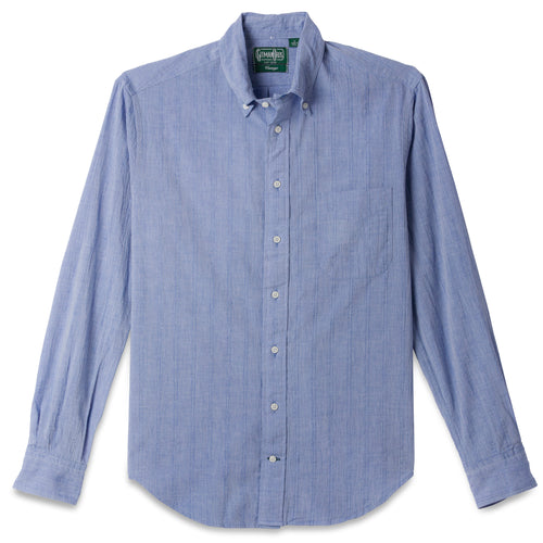 The Blue Chambray Dobby Stripe button down shirt, with a front pocket and white buttons on a stitched placket.