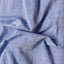 The texture of the fabric on the Blue Chambray Dobby Stripe shirt.