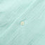 The white button on the front of placket.