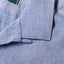 The top button loop on the collar.