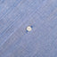 The white button on the front of placket.