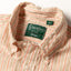 A close-up of the button down collar.