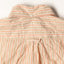 The back of the Tan Awning Stripe shirt with a button on the back of the collar and the locker loop on the back.