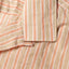 The top button loop on the collar.