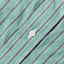 A close-up of the white button on the stitched placket.