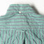 The back of the Green Awning Stripe shirt with a button on the back of the collar and the locker loop on the back.