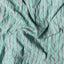 The texture on the fabric of the Green Awning Stripe Camp Shirt.