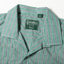 A close-up of the camp collar on the Green Awning Stripe Camp Shirt.