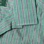 A close-up of the top button loop on the camp collar.