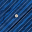 A close-up of the white button on the stitched placket.