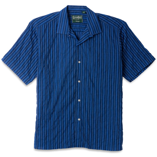 The Indigo Awning Stripe Camp Shirt, with short sleeves  and white buttons on the front.