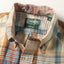 A close-up of the button down collar.