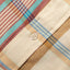 The stitched placket with a white button.