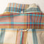 The back of the Tan Archive Madras with a button on the back of the collar and the locker loop on the back.