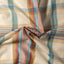 The texture of the fabric of the Tan Archive Madras.