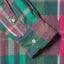 The barrel cuffs on the sleeve of the Plum Ikat Madras with white buttons.