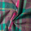The texture of the fabric of the Plum Ikat Madras.
